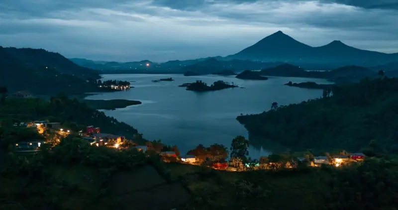 Lake Mutanda and the Virunga volcanoes at dusk from Chameleon Hill Lodge