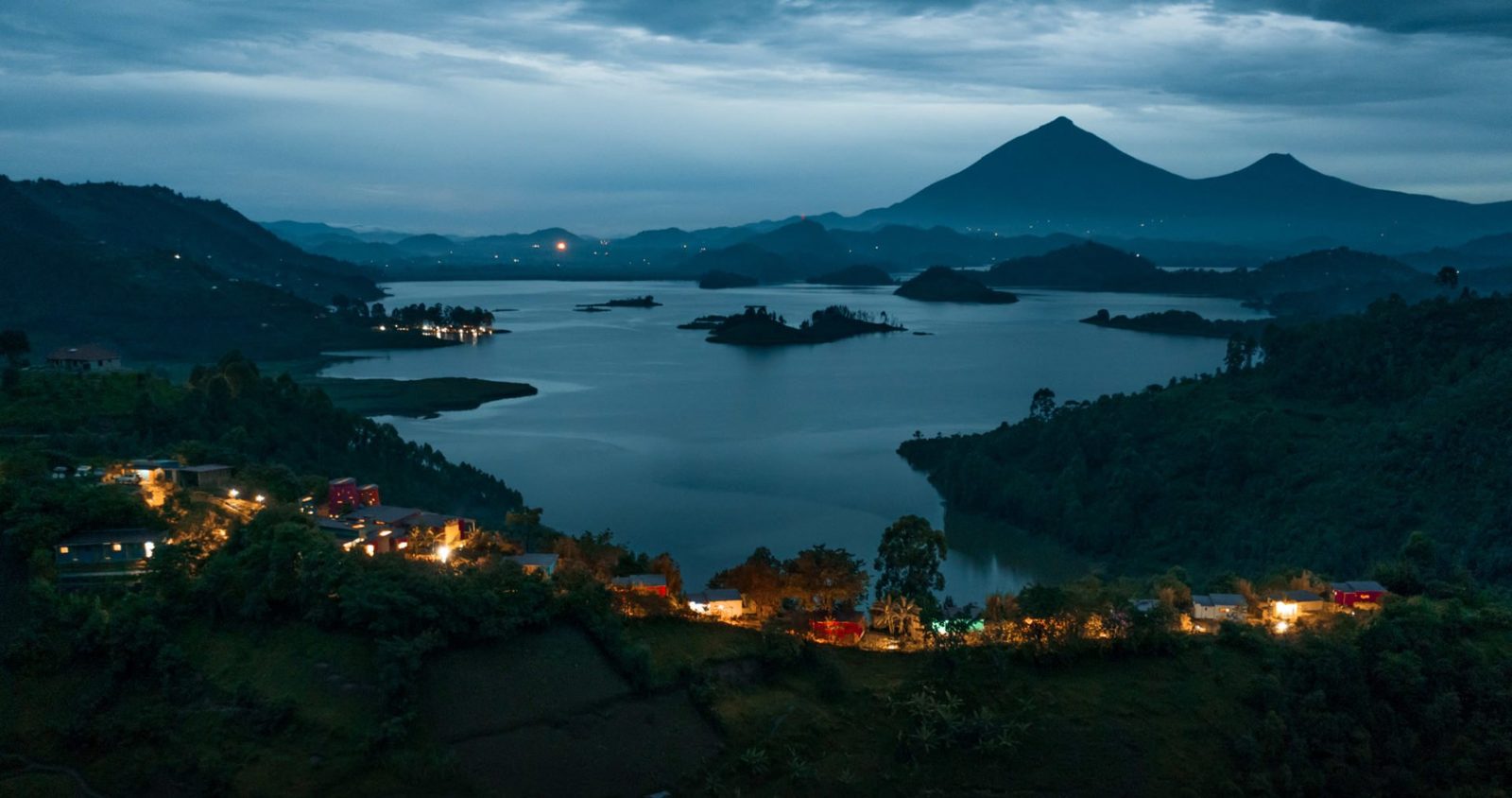 Lake Mutanda and the Virunga volcanoes at dusk from Chameleon Hill Lodge