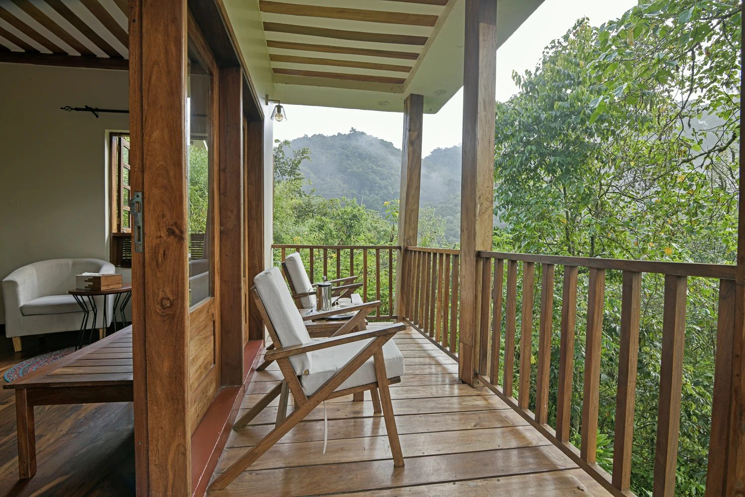 Private cottage veranda overlooking Bwindi forest at Four Gorillas Lodge