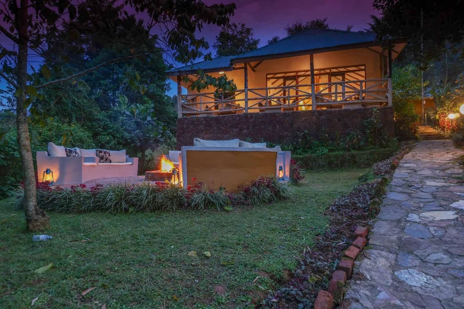 Gorilla Safari Lodge main building lit up in the evening, Rushaga
